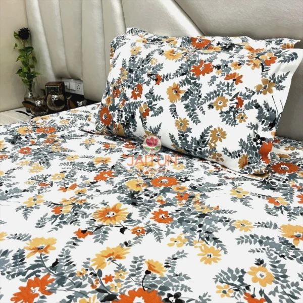 Autumn Garden Bloom bed sheet set styled in a bedroom setup, showcasing full floral layout and pillow covers