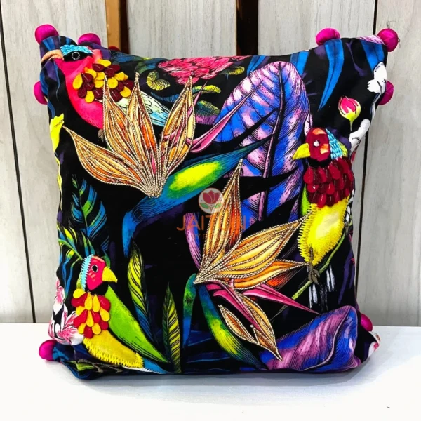 Close-up embroidery details of Birdsong Jungle cushion cover featuring vibrant birds and flowers