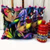 Embroidered cushion cover with tropical birds and jungle leaves on black background