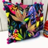 Side view of Birdsong Jungle embroidered cushion cover showing colourful parrot embroidery