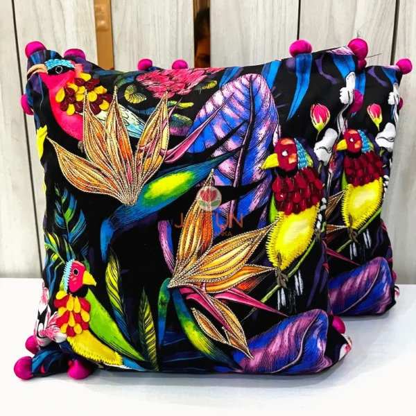 Pair of Birdsong Jungle embroidered cushion covers with floral and bird patterns