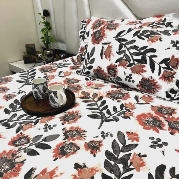 Decor view of Bold Blossom Bed Sheet Set on bed, featuring floral printed pillow covers and a cozy bedroom setup