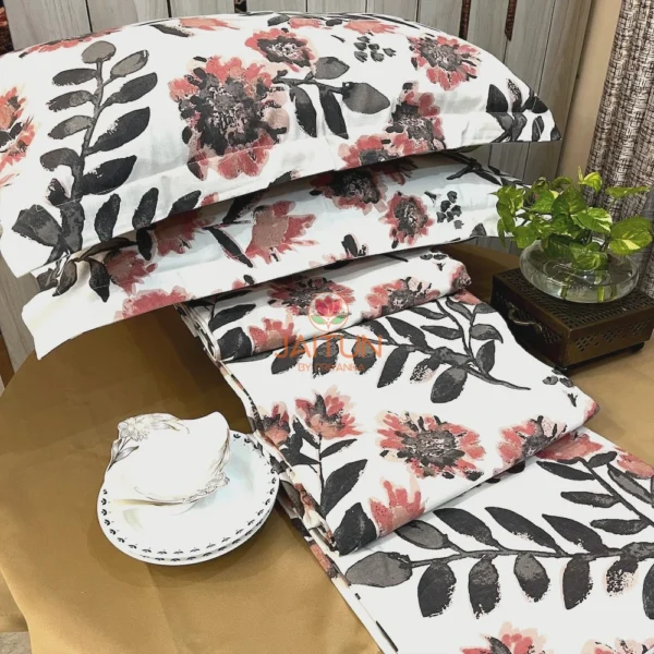 Arrangement of Bold Blossom Bed Sheet Set showcasing bold floral pattern, pillow covers, and decorative accents