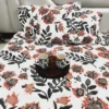 Bold Blossom Bed Sheet Set spread on bed with bold floral design, accompanied by mugs and a decorative tray