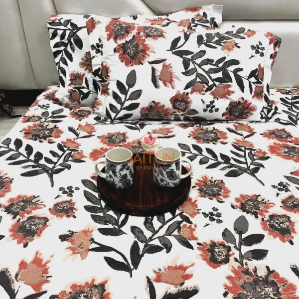 Bold Blossom Bed Sheet Set spread on bed with bold floral design, accompanied by mugs and a decorative tray