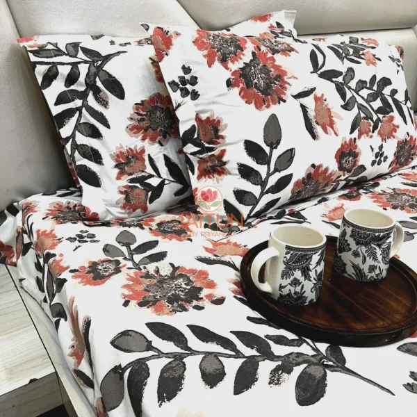 Closeup of Bold Blossom Bed Sheet Set pillow covers with large, bold floral motifs and leaf accents