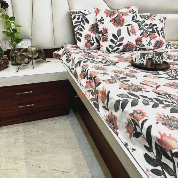 Room display of Bold Blossom Bed Sheet Set showcasing vibrant flower and leaf patterns on white cotton