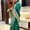 Side pose in Emerald Enchant Wedding Collection Sharara Suit Set highlighting ornate dupatta with gold embroidery