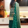 Back view of Emerald Enchant Sharara Suit Set draped with embroidered green dupatta and detailed gold borders