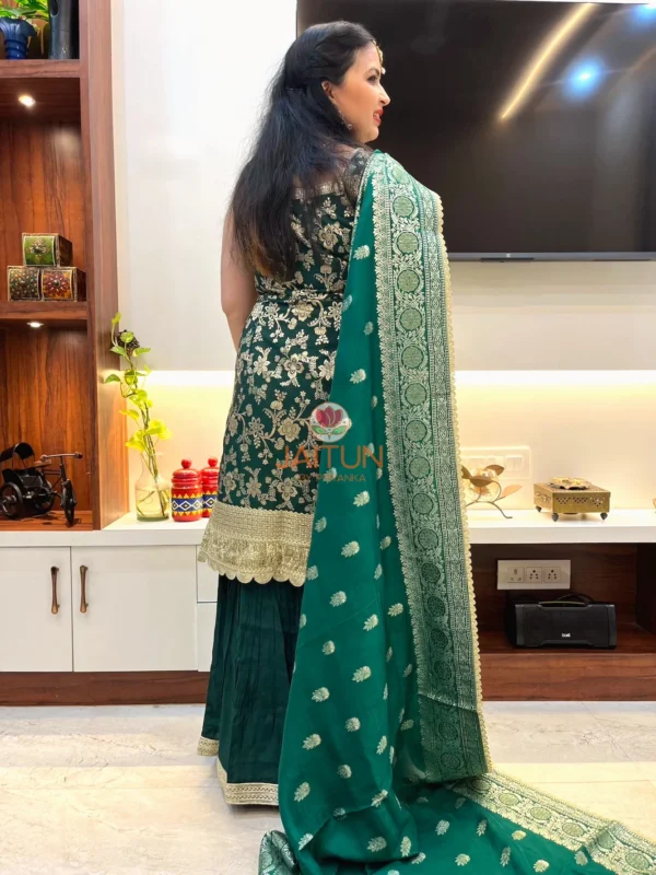 Back view of Emerald Enchant Sharara Suit Set draped with embroidered green dupatta and detailed gold borders