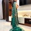 Rear angle of Emerald Enchant Sharara Suit Set featuring trailing embroidered dupatta and traditional wedding suit styling