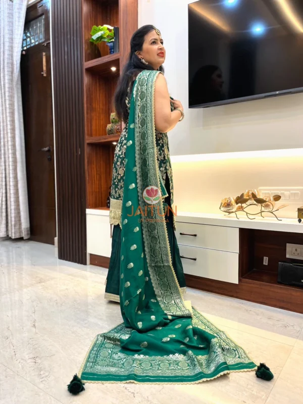 Rear angle of Emerald Enchant Sharara Suit Set featuring trailing embroidered dupatta and traditional wedding suit styling