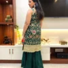 Back view of Emerald Enchant Wedding Collection Sharara Suit Set featuring green kurta with heavy gold embroidery and sharara pants