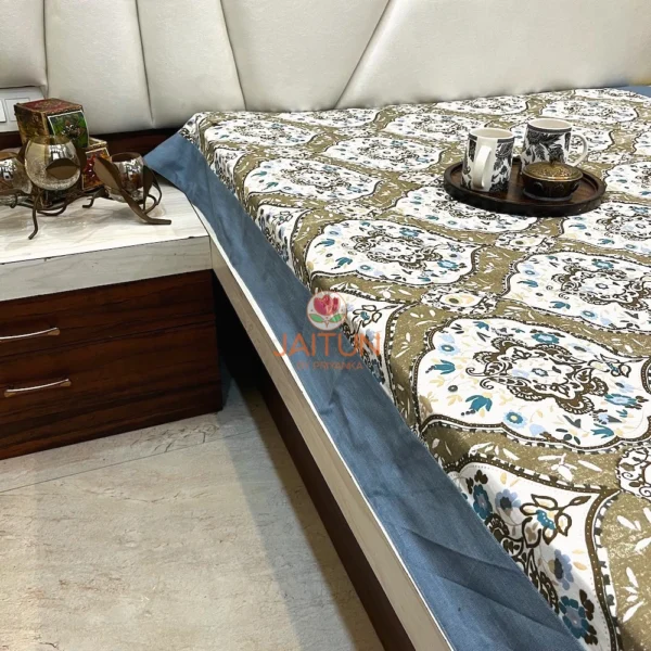 Corner view of Heirloom Damask bed sheet set highlighting blue border and all-over damask pattern on a bedroom setup