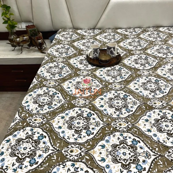 Full spread of Heirloom Damask bed sheet set on bed, featuring elegant brown and blue floral damask motifs