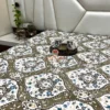 Heirloom Damask bed sheet set spread on bed, featuring damask floral print, cups on a tray, and soft beige headboard