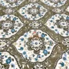 Closeup of Heirloom Damask bed sheet set showing fine details of brown, blue, and ivory damask floral pattern