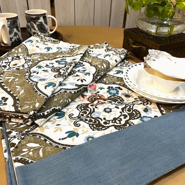 Heirloom Damask bed sheet set featuring intricate floral damask patterns in beige and blue with tableware and cups