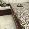 Kalahari Ikat Geometric Bedsheet Set displayed on bed, showing classic ikat diamond motifs and deep brown border