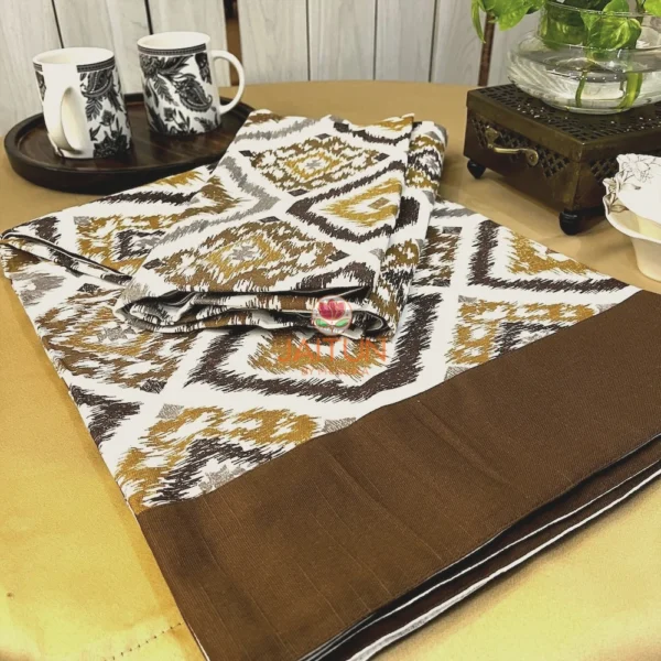 Kalahari Ikat Geometric Bed sheet Set displayed with mugs and wooden tray, featuring brown and mustard geometric pattern and solid border
