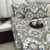 Angle display of Siena Heritage Damask Bed Sheet Set showing all-over damask pattern and pillow covers in a bedroom