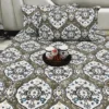 Full view of Siena Heritage Damask Bed Sheet Set covering bed and pillows, displaying olive green and blue damask prints