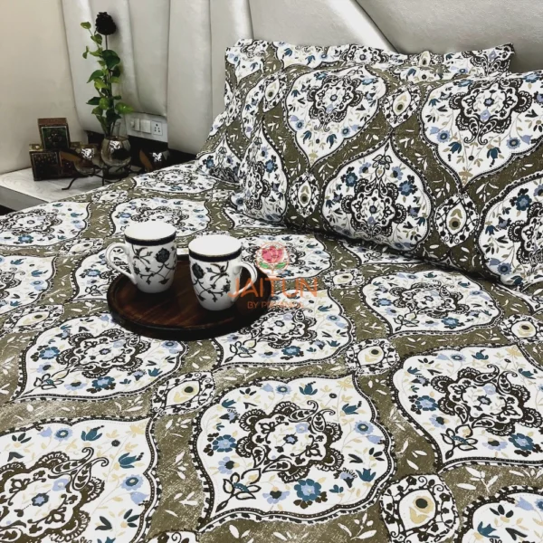 Siena Heritage Damask Bed Sheet Set spread on bed with coordinated pillow covers and tray of mugs, highlighting elegant floral motifs