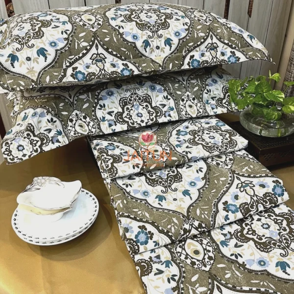 Siena Heritage Damask Bed Sheet Set displayed with white tableware, featuring intricate blue and olive damask designs