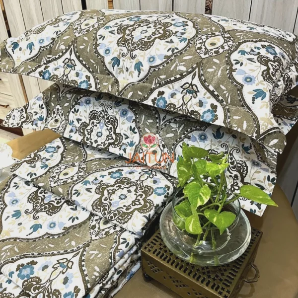 Siena Heritage Damask Bed Sheet Set styled with green plant decor, showcasing classic olive and beige damask print