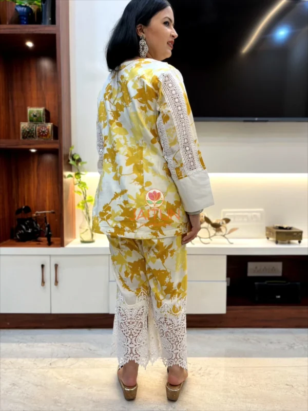 Back view of Sunlit Grace Co-ord Set with floral yellow print and scalloped white lace on pant hems