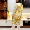 Rear side angle of Sunlit Grace Co-ord Set displaying yellow foliage print and lace accents