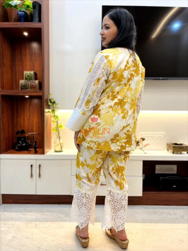 Rear side angle of Sunlit Grace Co-ord Set displaying yellow foliage print and lace accents