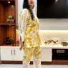 Side profile of Sunlit Grace Co-ord Set displaying yellow and white floral design with lace accents on sleeves and pants