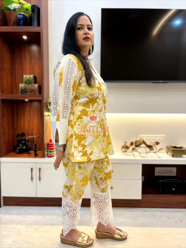 Side profile of Sunlit Grace Co-ord Set displaying yellow and white floral design with lace accents on sleeves and pants