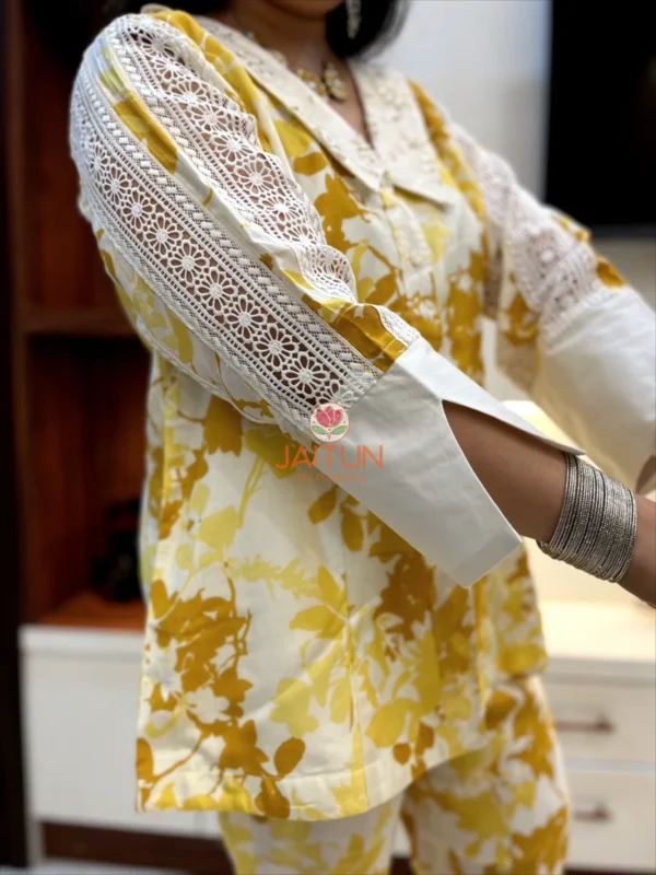 Detailed sleeve view of Sunlit Grace Co-ord Set highlighting intricate white lacework on yellow floral fabric