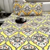 Sunshine Elegance Yellow Bloom bed sheet with two mugs on a tray, set on a bed for a warm and inviting atmosphere.
