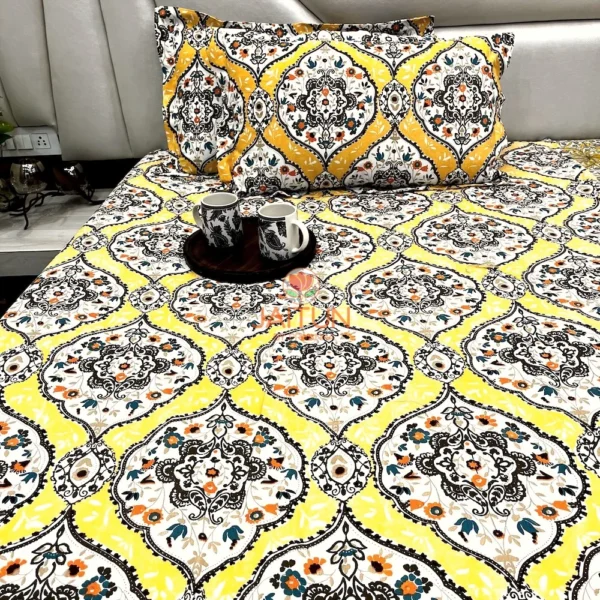 Sunshine Elegance Yellow Bloom bed sheet with two mugs on a tray, set on a bed for a warm and inviting atmosphere.