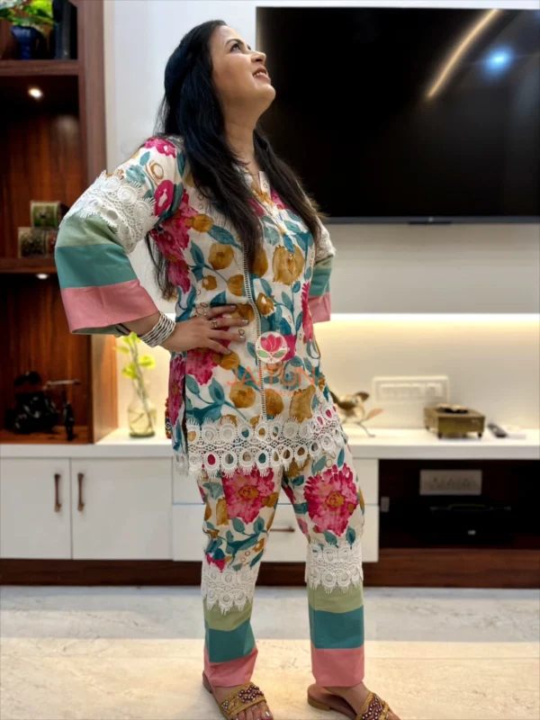 Model striking a fashion pose in the Tropical Bloom Co-ord Set with floral and lace details