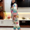 Woman wearing Tropical Bloom Co-ord Set side view showcasing floral print and lace details