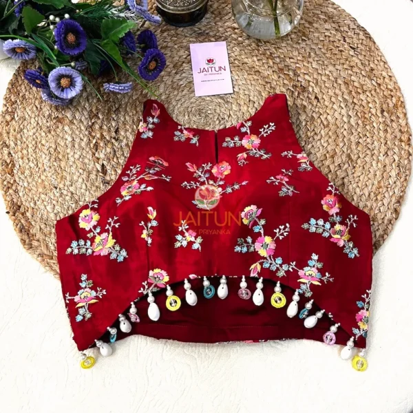 Back view of Crimson Bloom Hand-Embroidered Wedding Blouse featuring intricate embroidered details, high-neck design, and multicolour bead and pearl drop embellishments for bridal and festive wear.