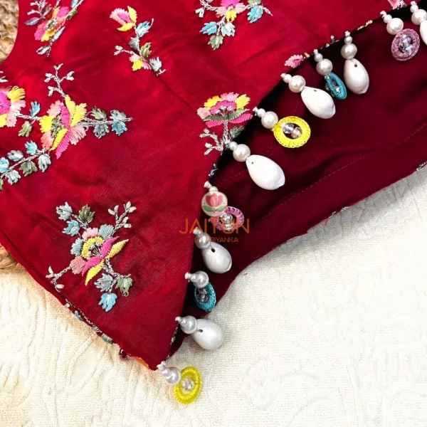 Close-up view showing intricate Mughal-inspired multicolor floral embroidery and exquisite hand-embroidered details on the Crimson Bloom Wedding Blouse.
