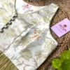Close-up of the Designer Olive Garden Brocade Peplum Blouse highlighting floral embroidery, button accents, and luxury fabric texture for bridal wear.