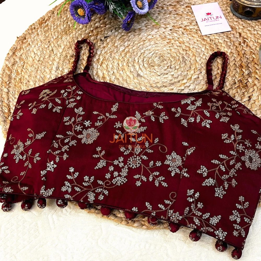 Back view of Maroon Regal Bloom Embroidered Wedding Collection Blouse featuring designer straps and golden floral motifs, ideal for weddings and receptions.