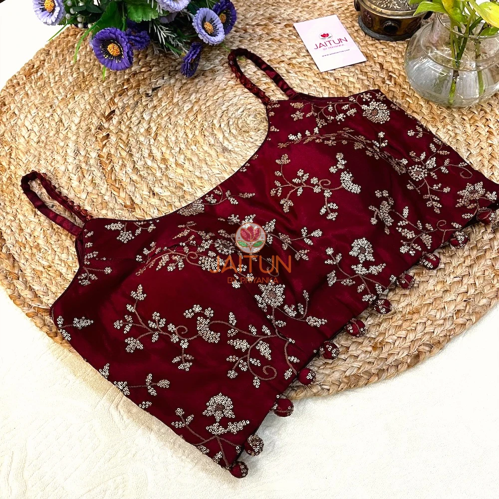 Angled front display of Maroon Regal Bloom Wedding Collection Blouse showing sequin floral embroidery and stylish bead tassels, perfect for modern brides.
