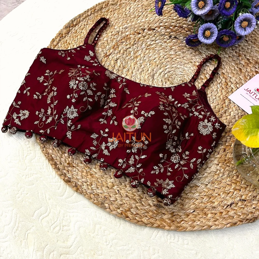 Angled front display of Maroon Regal Bloom Wedding Collection Blouse showing sequin floral embroidery and stylish bead tassels, perfect for modern brides.
