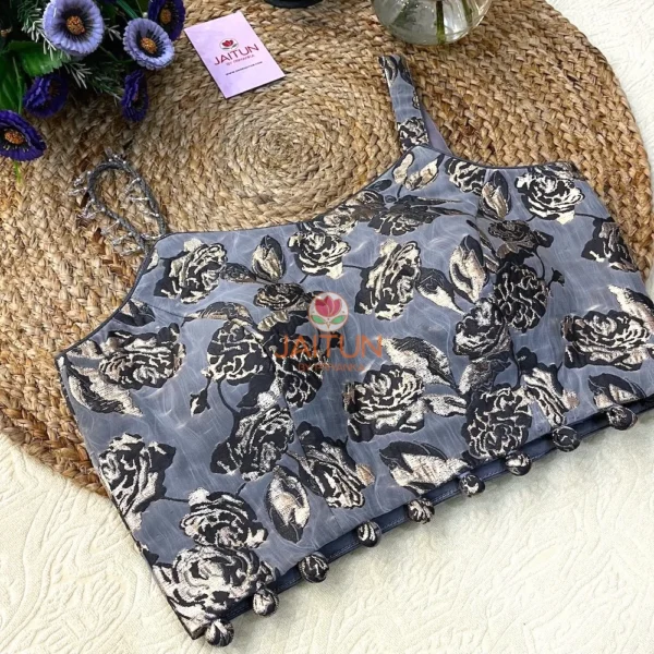 Angled front display of Midnight Bloom Metallic Floral Wedding Blouse showing dual straps and intricate black and gold floral motifs for ethnic occasions.