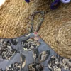 Close-up of metallic black and gold floral pattern on luxe grey fabric of the Midnight Bloom Wedding Blouse, designed for weddings.