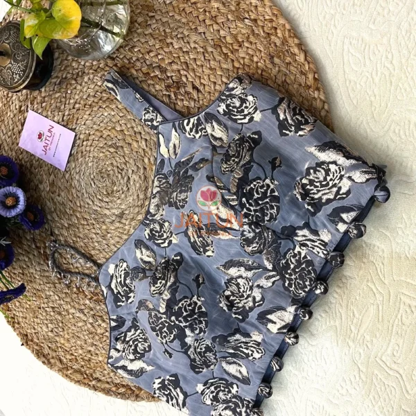Close-up of dual strap design and metallic floral weaving on the Midnight Bloom Wedding Blouse, highlighting artisan details.