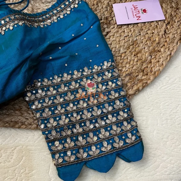 Close-up of artisan kundan work on Royal Blue Silk Blouse sleeves, showcasing detailed hand embroidery for wedding bride outfits.