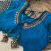 Back view of Royal Blue Kundan Silk Blouse showing tie-back strings with decorative tassels and elegant silk craftsmanship.